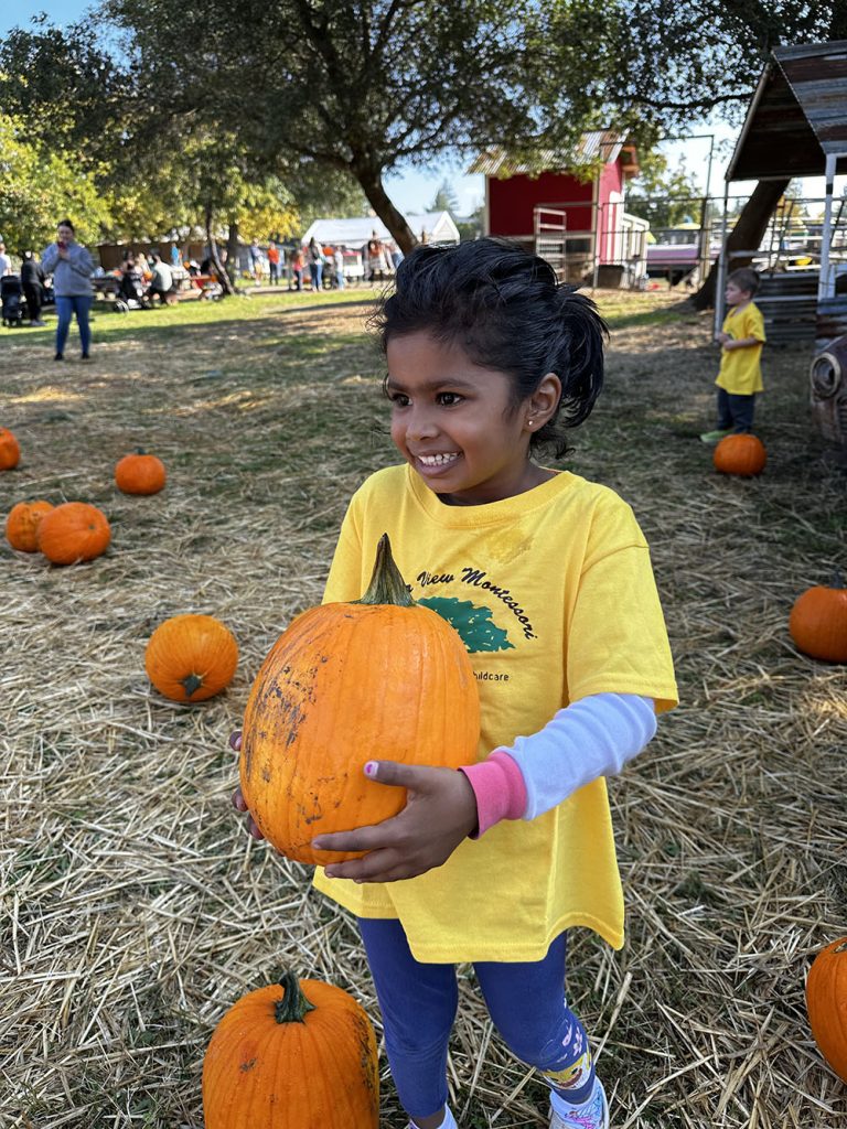 Girl holding pumpking